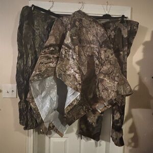 Camouflage Hunting poncho and 2 Pants, one pants size xl the other 2xl